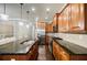 Well-lit kitchen offering dark granite countertops, stainless appliances, and sleek cabinetry at 2227 W Village Se Ln, Smyrna, GA 30080