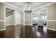 Bright living room with hardwood floors and framed entryways at 2227 W Village Se Ln, Smyrna, GA 30080