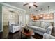 Open-concept living room featuring modern furnishings and hardwood floors at 2227 W Village Se Ln, Smyrna, GA 30080