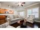 Spacious living area with a view of the kitchen, featuring hardwood floors and natural light at 2227 W Village Se Ln, Smyrna, GA 30080