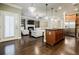 Open floor plan with stainless appliances, fireplace, and hardwood flooring at 2227 W Village Se Ln, Smyrna, GA 30080