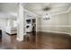 Open-concept living room with hardwood floors and a view of the adjacent sitting area at 2227 W Village Se Ln, Smyrna, GA 30080