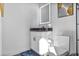 Modern bathroom features a floating vanity with a black countertop and a sleek, lighted mirror at 3120 Godby Rd, Atlanta, GA 30349