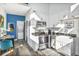Modern kitchen featuring white cabinets, stainless steel appliances, and stylish countertops, seamlessly connected to dining at 3120 Godby Rd, Atlanta, GA 30349
