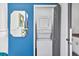 This well-appointed laundry area has a stackable washer and dryer next to a crisp blue wall at 3120 Godby Rd, Atlanta, GA 30349