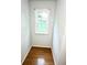 Small alcove with hardwood flooring and a view to the backyard at 1411 Blackland Trl, Lawrenceville, GA 30043