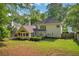A large backyard features nice landscaping around a house at 1411 Blackland Trl, Lawrenceville, GA 30043
