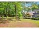 A large backyard features nice landscaping around a house at 1411 Blackland Trl, Lawrenceville, GA 30043