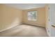 A cozy bedroom features neutral walls and carpet, providing a peaceful and comfortable space at 1411 Blackland Trl, Lawrenceville, GA 30043
