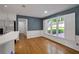 Bright dining area featuring hardwood floors, large windows with charming white shutters and a view to the backyard at 1411 Blackland Trl, Lawrenceville, GA 30043