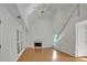 Spacious living room with fireplace, large windows, hardwood floors and staircase to the upper level at 1411 Blackland Trl, Lawrenceville, GA 30043