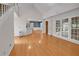 Bright living room with hardwood floors, fireplace, views to the backyard and access to the kitchen at 1411 Blackland Trl, Lawrenceville, GA 30043