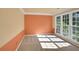 Spacious living room with neutral carpet, large windows, and a two-tone paint scheme at 1411 Blackland Trl, Lawrenceville, GA 30043