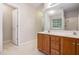 Bathroom featuring a double vanity and a door to a shower/tub combo at 1595 Cedar Hl, Douglasville, GA 30134