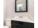Cozy bathroom with a black vanity and a well-lit mirror at 1595 Cedar Hl, Douglasville, GA 30134