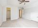 Bright bedroom features a ceiling fan, neutral carpet, and closet at 1595 Cedar Hl, Douglasville, GA 30134