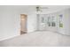 Bright bedroom featuring neutral carpet, a ceiling fan, and plenty of natural light at 1595 Cedar Hl, Douglasville, GA 30134