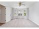 Bright bedroom featuring neutral carpet, a ceiling fan, and lots of natural light at 1595 Cedar Hl, Douglasville, GA 30134