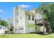 Exterior of a two-story home with a deck, stairs, and two-car garage at 1595 Cedar Hl, Douglasville, GA 30134