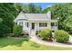 Charming home with a manicured lawn, covered porch and mature landscaping at 1595 Cedar Hl, Douglasville, GA 30134