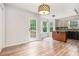 Bright eat-in kitchen area with a door to a wooden deck, island and many windows at 1595 Cedar Hl, Douglasville, GA 30134