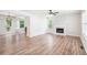 Open-concept living room boasting hardwood floors, a fireplace, and natural light at 1595 Cedar Hl, Douglasville, GA 30134