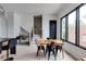 Open dining space with modern black chairs, a desk, and large window at 1968 8Th St, Chamblee, GA 30341