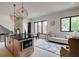 Open-concept kitchen and living area with modern island, dining table, and cozy seating area at 1968 8Th St, Chamblee, GA 30341