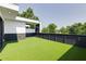 Rooftop terrace features black trim on white siding and bright green turf at 1968 8Th St, Chamblee, GA 30341