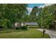 Charming single-story brick home nestled among mature trees with a well-maintained lawn and ample curb appeal at 3250 Valley Bend Rd, South Fulton, GA 30349