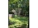 Fenced backyard with a storage shed and mature trees offers private outdoor space at 3594 Broxton Ln, Snellville, GA 30039