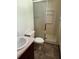 Small bathroom featuring linoleum flooring, shower, and toilet next to the vanity at 3594 Broxton Ln, Snellville, GA 30039