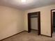 Bedroom featuring carpet floors, an open closet, and access to the hallway at 3594 Broxton Ln, Snellville, GA 30039
