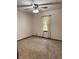 Bedroom featuring neutral walls, carpet flooring, and ceiling fan with light fixture at 3594 Broxton Ln, Snellville, GA 30039