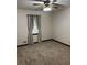 Bedroom featuring neutral walls, carpet flooring, and ceiling fan with light fixture at 3594 Broxton Ln, Snellville, GA 30039