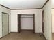 Bedroom featuring carpet flooring, neutral walls, and an open closet at 3594 Broxton Ln, Snellville, GA 30039