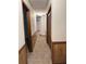 Hallway featuring wood paneling, carpet flooring, and closet at 3594 Broxton Ln, Snellville, GA 30039