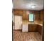 Traditional kitchen featuring wood cabinetry, wood countertops, and white appliances at 3594 Broxton Ln, Snellville, GA 30039