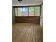 Spacious wooden screened-in porch offers plenty of room for outdoor seating at 3594 Broxton Ln, Snellville, GA 30039
