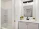 Bright bathroom with a new-looking sink, fixtures, vanity, and shower-tub combo at 944 Pine Ridge Dr, Stone Mountain, GA 30087