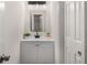 Bright bathroom with a new-looking sink, fixtures, vanity, and door at 944 Pine Ridge Dr, Stone Mountain, GA 30087