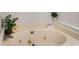 Jetted bathtub with tile surround at 944 Pine Ridge Dr, Stone Mountain, GA 30087
