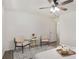 Bright bedroom with a decorative rug, a ceiling fan, and two armchairs at 944 Pine Ridge Dr, Stone Mountain, GA 30087