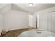 Neutral bedroom featuring wood floors, a closet, and a comfortable bed with stylish decor at 944 Pine Ridge Dr, Stone Mountain, GA 30087