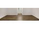 Bright bedroom featuring wood floors, a window, and neutral walls at 944 Pine Ridge Dr, Stone Mountain, GA 30087