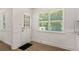 Open dining room with lots of windows at 944 Pine Ridge Dr, Stone Mountain, GA 30087