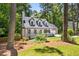Charming exterior featuring a well-manicured front yard and inviting entrance to the Cape Cod-style home at 944 Pine Ridge Dr, Stone Mountain, GA 30087
