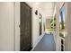 A welcoming covered porch featuring contemporary colors, lighting, and a view to the landscaped yard at 944 Pine Ridge Dr, Stone Mountain, GA 30087