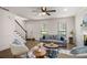 Welcoming living room with fireplace, staircase, ceiling fan, and hardwood floors at 944 Pine Ridge Dr, Stone Mountain, GA 30087