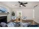 Comfortable living room showcases a fireplace and hardwood floors and neutral walls at 944 Pine Ridge Dr, Stone Mountain, GA 30087